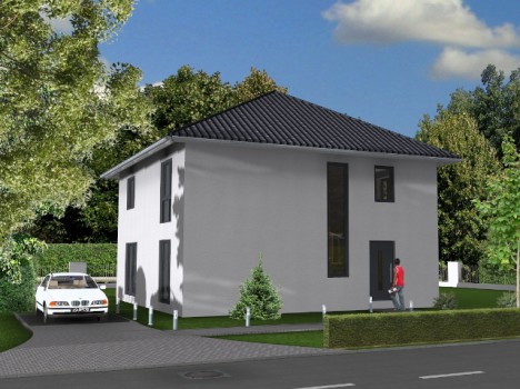 In der malerischen Szenerie steht ein modernes zweistöckiges Haus mit einem dunklen, schrägen Dach und großen Fenstern. Eine Person schlendert auf dem Bürgersteig vor dem von Hecken gesäumten Hof entlang, typisch für ein Fertighaus in Dresden. Auf der Einfahrt parkt ein Auto, während Bäume und ein klarer Himmel diese schöne Kulisse betonen.